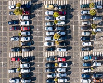 Aerial drone view above cars at parking-stock-foto