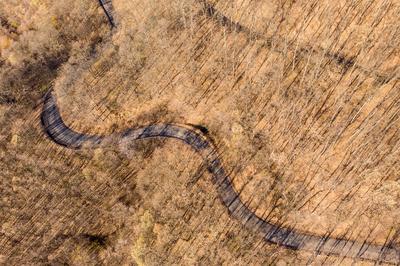 Aerial drone view from a cury road in mecsek-stock-photo