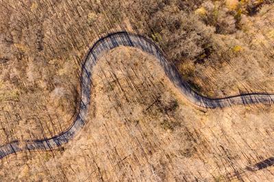 Aerial drone view from a cury road in mecsek-stock-foto