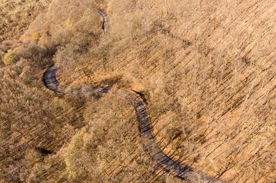 Aerial drone view from a cury road in mecsek-stock-photo