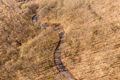 Aerial drone view from a cury road in mecsek-stock-photo