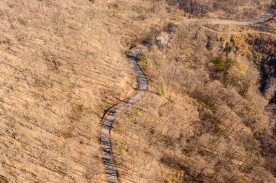 Aerial drone view from a cury road in mecsek-stock-photo