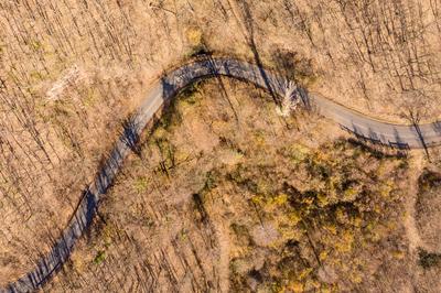 Aerial drone view from a cury road in mecsek-stock-photo