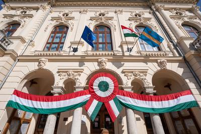 Town hall in Kisujszallas with march 15 decoriation-stock-photo