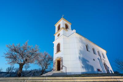 Small chapel with almond tree, called havas boldogasszony templom-stock-photo