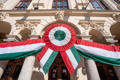 Town hall in Kisujszallas with march 15 decoriation-stock-photo