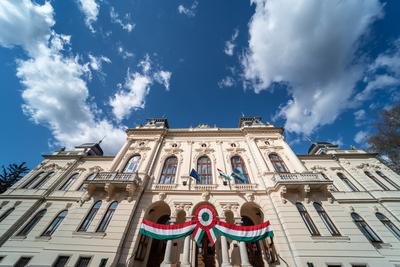 Town hall in Kisujszallas with march 15 decoriation-stock-photo