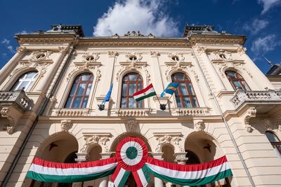 Town hall in Kisujszallas with march 15 decoriation-stock-photo