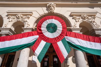 Town hall in Kisujszallas with march 15 decoriation-stock-photo