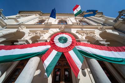 Town hall in Kisujszallas with march 15 decoriation-stock-photo