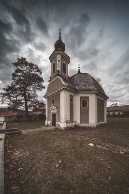 Small chapel with stormy clouds, before rain-stock-photo