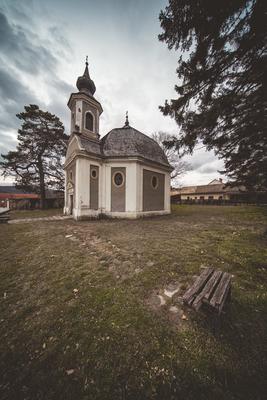 Small chapel with stormy clouds, before rain-stock-photo