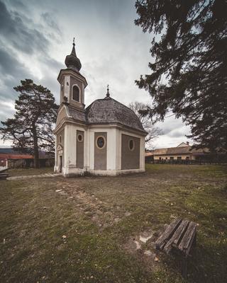 Small chapel with stormy clouds, before rain-stock-foto
