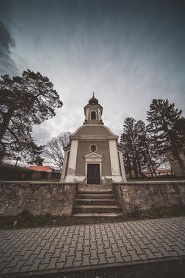 Small chapel with stormy clouds, before rain-stock-photo