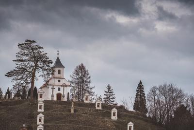 Small chapel with stormy clouds, before rain-stock-foto