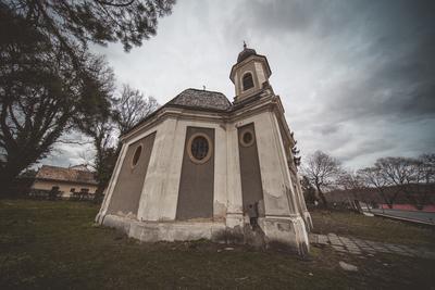 Small chapel with stormy clouds, before rain-stock-foto