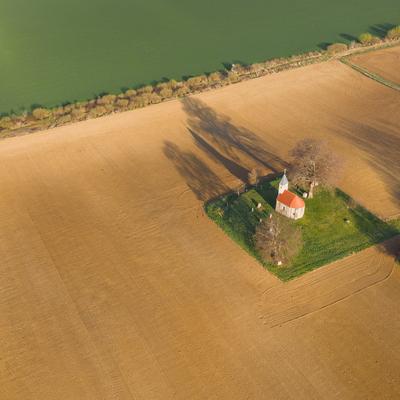 aerial photo of a small chapel with morning sunshine-stock-photo