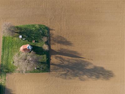 aerial photo of a small chapel with morning sunshine-stock-photo