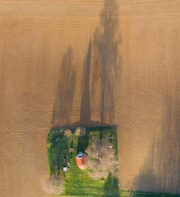 aerial photo of a small chapel with morning sunshine-stock-photo