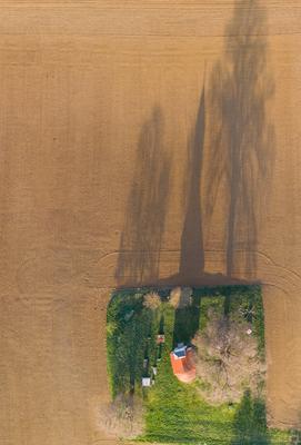 aerial photo of a small chapel with morning sunshine-stock-photo