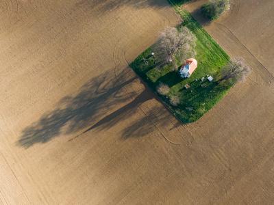 aerial photo of a small chapel with morning sunshine-stock-photo