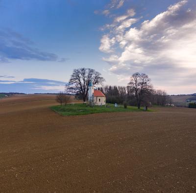 aerial photo of a small chapel with morning sunshine-stock-photo