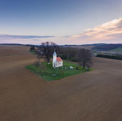 aerial photo of a small chapel with morning sunshine-stock-photo