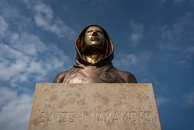 Budapest, Hungary -August 7, .2022:  Portrait of the statue of Satoshi Nakamoto mysterious founder of Bitcoin and Blockchain technology in; created by Reka Gergely and Tamas Gilly.  August 7, .2022 in Budapest, Hungary.-stock-photo