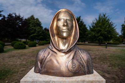 Budapest, Hungary -August 7, .2022:  Portrait of the statue of Satoshi Nakamoto mysterious founder of Bitcoin and Blockchain technology in; created by Reka Gergely and Tamas Gilly.  August 7, .2022 in Budapest, Hungary.-stock-photo