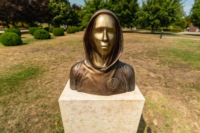 Budapest, Hungary -August 7, .2022:  Portrait of the statue of Satoshi Nakamoto mysterious founder of Bitcoin and Blockchain technology in; created by Reka Gergely and Tamas Gilly.  August 7, .2022 in Budapest, Hungary.-stock-photo