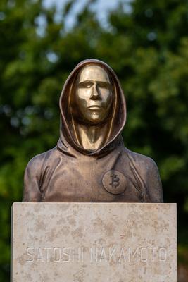 Budapest, Hungary -August 7, .2022:  Portrait of the statue of Satoshi Nakamoto mysterious founder of Bitcoin and Blockchain technology in; created by Reka Gergely and Tamas Gilly.  August 7, .2022 in Budapest, Hungary.-stock-photo