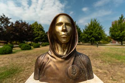 Budapest, Hungary -August 7, .2022:  Portrait of the statue of Satoshi Nakamoto mysterious founder of Bitcoin and Blockchain technology in; created by Reka Gergely and Tamas Gilly.  August 7, .2022 in Budapest, Hungary.-stock-photo