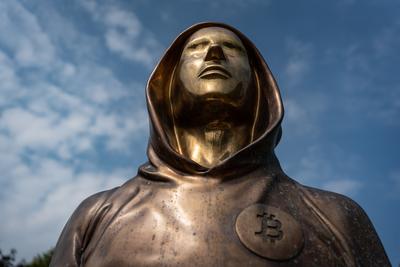 Budapest, Hungary -August 7, .2022:  Portrait of the statue of Satoshi Nakamoto mysterious founder of Bitcoin and Blockchain technology in; created by Reka Gergely and Tamas Gilly.  August 7, .2022 in Budapest, Hungary.-stock-photo