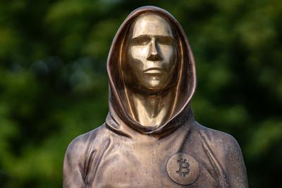 Budapest, Hungary -August 7, .2022:  Portrait of the statue of Satoshi Nakamoto mysterious founder of Bitcoin and Blockchain technology in; created by Reka Gergely and Tamas Gilly.  August 7, .2022 in Budapest, Hungary.-stock-photo