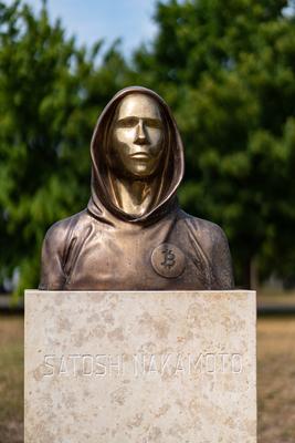 Budapest, Hungary -August 7, .2022:  Portrait of the statue of Satoshi Nakamoto mysterious founder of Bitcoin and Blockchain technology in; created by Reka Gergely and Tamas Gilly.  August 7, .2022 in Budapest, Hungary.-stock-photo