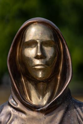 Budapest, Hungary -August 7, .2022:  Portrait of the statue of Satoshi Nakamoto mysterious founder of Bitcoin and Blockchain technology in; created by Reka Gergely and Tamas Gilly.  August 7, .2022 in Budapest, Hungary.-stock-photo