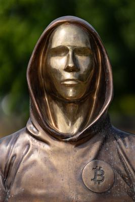 Budapest, Hungary -August 7, .2022:  Portrait of the statue of Satoshi Nakamoto mysterious founder of Bitcoin and Blockchain technology in; created by Reka Gergely and Tamas Gilly.  August 7, .2022 in Budapest, Hungary.-stock-photo