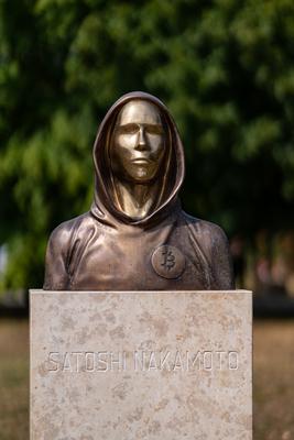 Budapest, Hungary -August 7, .2022:  Portrait of the statue of Satoshi Nakamoto mysterious founder of Bitcoin and Blockchain technology in; created by Reka Gergely and Tamas Gilly.  August 7, .2022 in Budapest, Hungary.-stock-photo