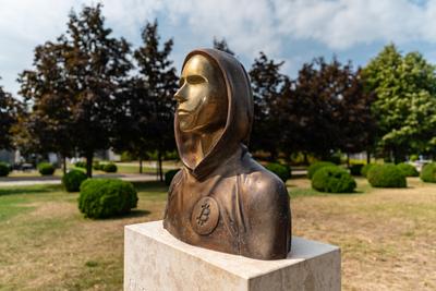 Budapest, Hungary -August 7, .2022:  Portrait of the statue of Satoshi Nakamoto mysterious founder of Bitcoin and Blockchain technology in; created by Reka Gergely and Tamas Gilly.  August 7, .2022 in Budapest, Hungary.-stock-photo