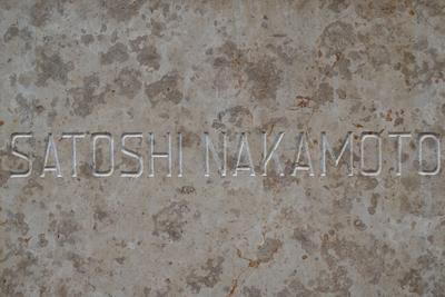 satoshi nakamoto text on a textured marble table-stock-photo