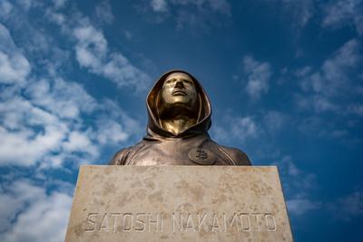 Budapest, Hungary -August 7, .2022:  Portrait of the statue of Satoshi Nakamoto mysterious founder of Bitcoin and Blockchain technology in; created by Reka Gergely and Tamas Gilly.  August 7, .2022 in Budapest, Hungary.-stock-photo