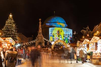 PECS, HUNGARY - DECEMBER 4 2022: Advent market with christmas tree at Szechenyi Square in Pecs. December 4, 2022 Pecs, Hungary-stock-photo