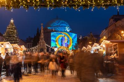 PECS, HUNGARY - DECEMBER 4 2022: Advent market with christmas tree at Szechenyi Square in Pecs. December 4, 2022 Pecs, Hungary-stock-photo