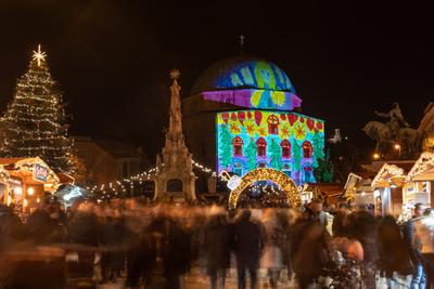 PECS, HUNGARY - DECEMBER 4 2022: Advent market with christmas tree at Szechenyi Square in Pecs. December 4, 2022 Pecs, Hungary-stock-photo