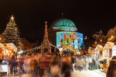 PECS, HUNGARY - DECEMBER 4 2022: Advent market with christmas tree at Szechenyi Square in Pecs. December 4, 2022 Pecs, Hungary-stock-photo