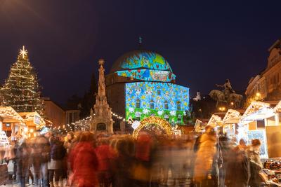 PECS, HUNGARY - DECEMBER 4 2022: Advent market with christmas tree at Szechenyi Square in Pecs. December 4, 2022 Pecs, Hungary-stock-photo