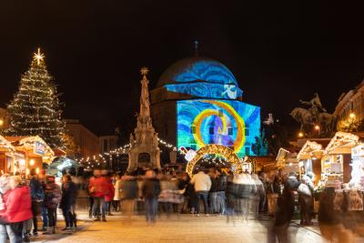 PECS, HUNGARY - DECEMBER 4 2022: Advent market with christmas tree at Szechenyi Square in Pecs. December 4, 2022 Pecs, Hungary-stock-photo