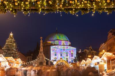 PECS, HUNGARY - DECEMBER 4 2022: Advent market with christmas tree at Szechenyi Square in Pecs. December 4, 2022 Pecs, Hungary-stock-photo