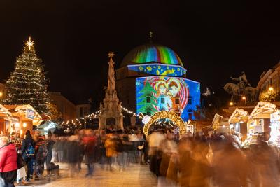 PECS, HUNGARY - DECEMBER 4 2022: Advent market with christmas tree at Szechenyi Square in Pecs. December 4, 2022 Pecs, Hungary-stock-photo