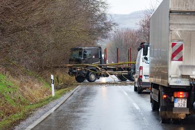 BOSZENFA, HUNGARY - JANUARY 10 2023: Fallen tree blocked the road and   caused congestion on the road Boszenfa. January 10 2023 Boszenfa, Hungary-stock-photo